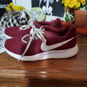 Women's maroon Nike running sneakers